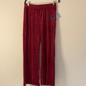 Wakanda Forever velour pants burgundy. Elastic waist band. Has symbol on front.